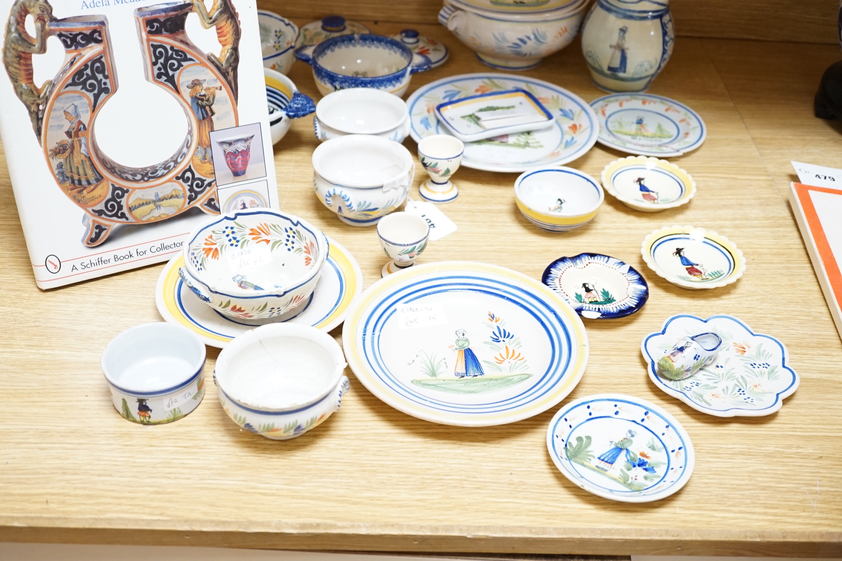 A group of Quimper pottery and a Quimper Pottery book by Angela Meadows